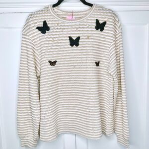 Hand-embellished butterfly sweater with pearl detailing.